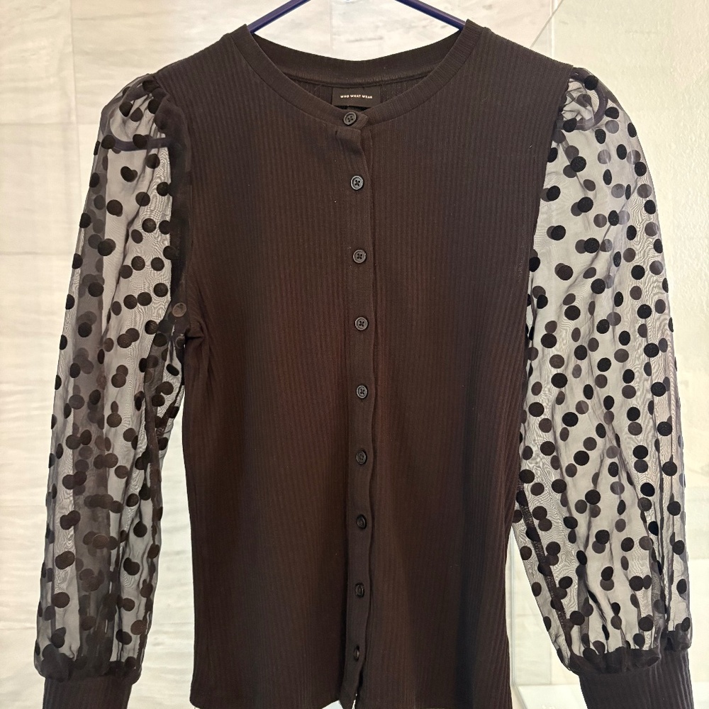 Who what wear black top with sheer polka dot sleeves